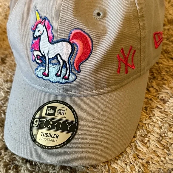 New Era Beige Cap with Unicorn Embroidery purchased at Yankee Stadium