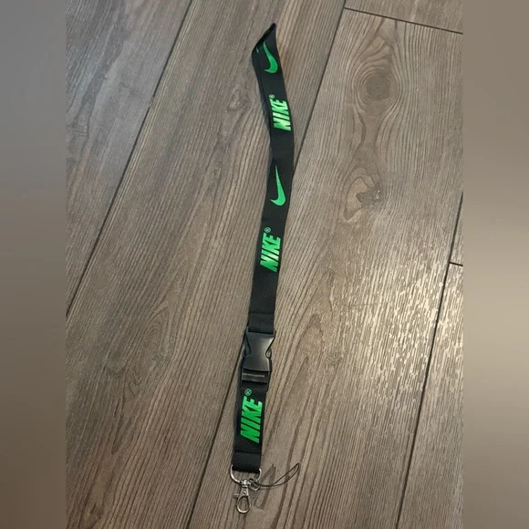 Black Nike Lanyard with Green Lettering