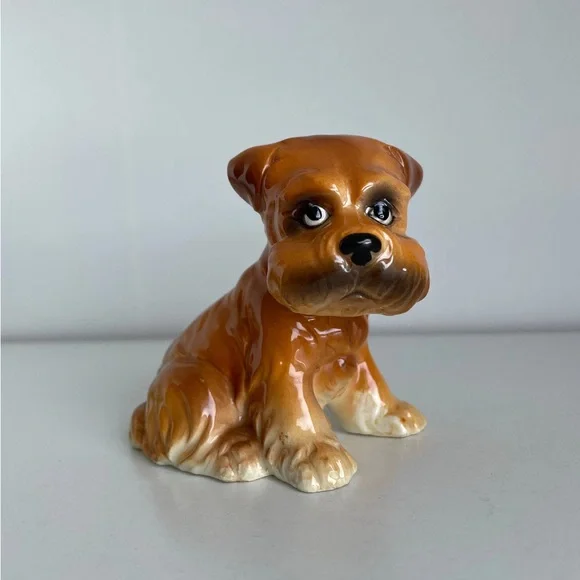 Vintage grumpy anthropomorphic brown dog figurine.