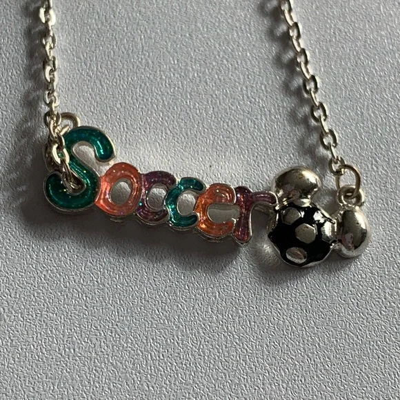 Disney girls soccer necklace.