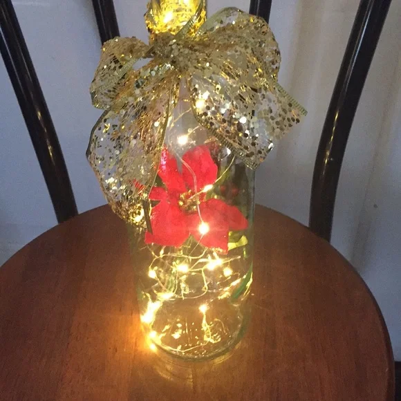 Red poinsettia wine bottle lantern