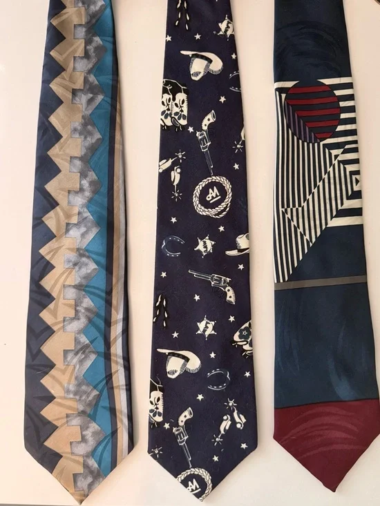 Three neckties. Oscar de la Renta, Oleg Cassini, Tango vintage ties.