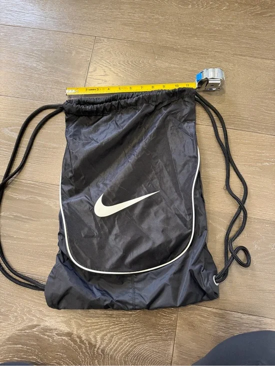 Nike Black Drawstring Backpack with White Swoosh