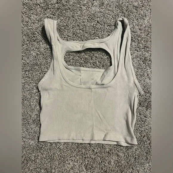La front cut Lululemon crop tank with cutout chest. Size 4/6