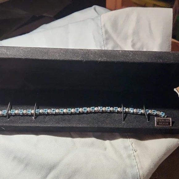 Blue topaz and silver tennis bracelet