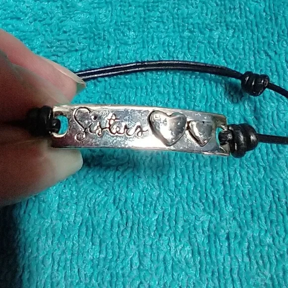 Silvertone 'Sisters' Heart Bracelet Black Cord