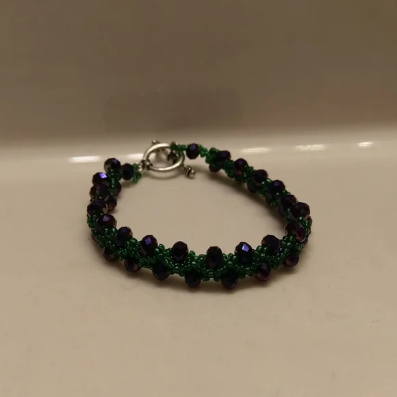 Purple and dark green beaded bracelet