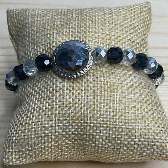 Beaded Stretch Bracelet With Faceted Black Clear Beads Silver Toned Centerpiece