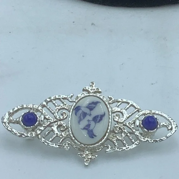 Silver-Tone Filigree Brooch with Blue/White Bird Design