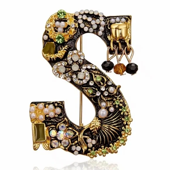 Elegant Gold and Black Brooch with Crystal Accents