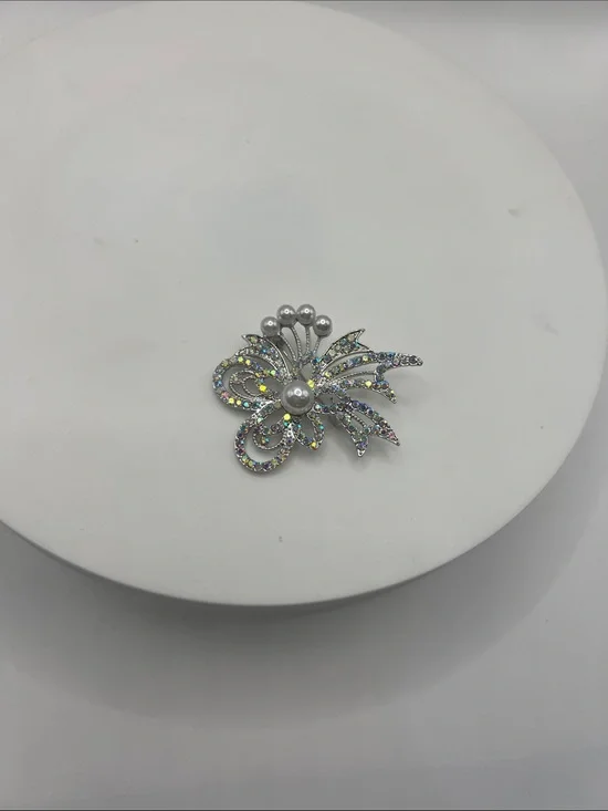 474. Silver Tone and Aurora Borealis Crystal Floral Brooch With Pearl Accents.