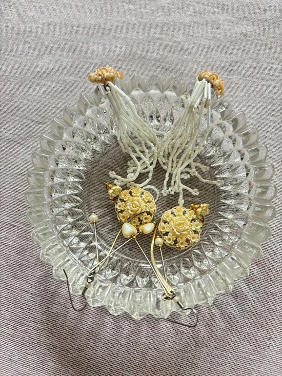 Set of three vintage cream earrings.