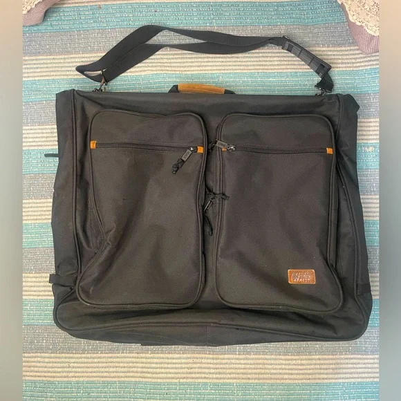 Korus: vintage wardrobe bag with suede leather accents