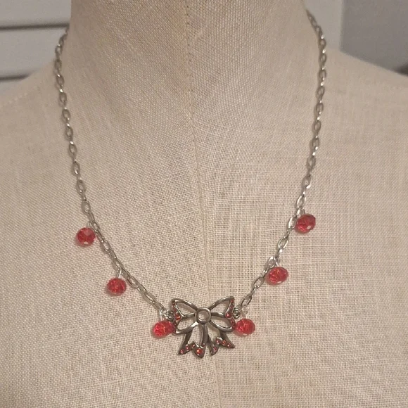 Elegant Silver and Red Bow Necklace
