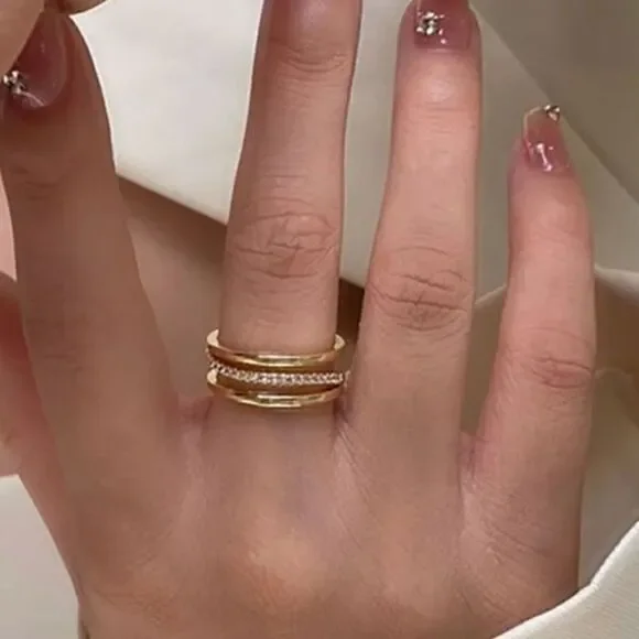 The Triple Bling Ring adjustable in 14k gold over 925 with cubic zirconia