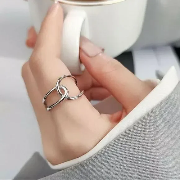 The Loop Ring in 925 silver adjustable sizing.