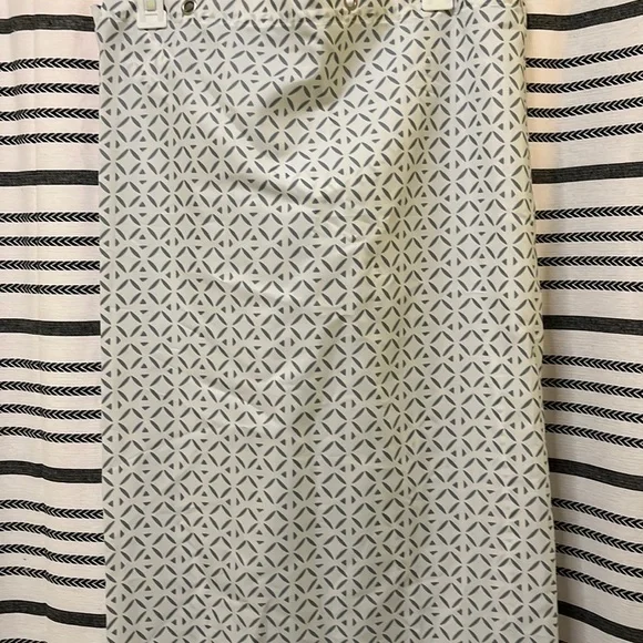Shower curtain with teal flower design at bottom