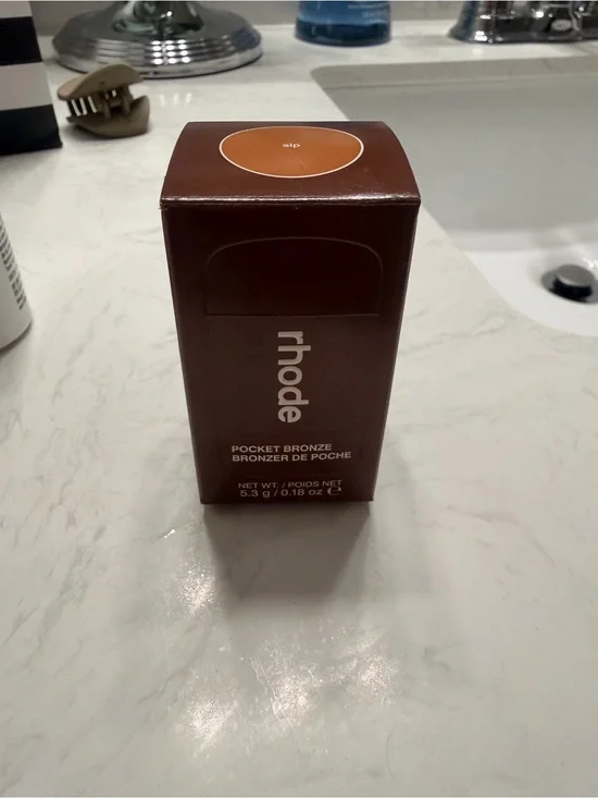 RHODE Pocket Bronze Compact in Deep Brown Packaging
