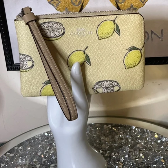 NWT Coach Corner Zip Wristlet with Lemon Print. Retail $83.00
