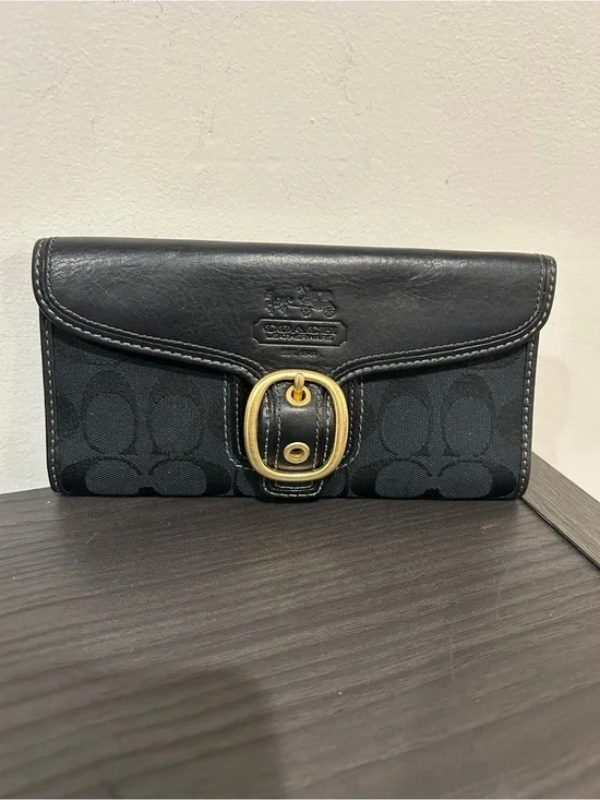 Coach Bleecker wallet light blue leather interior and a plaid tattersall lining.