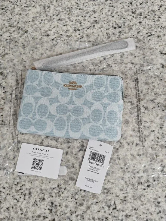 Coach Corner Zip Wristlet In Signature Canvas (Light blue)