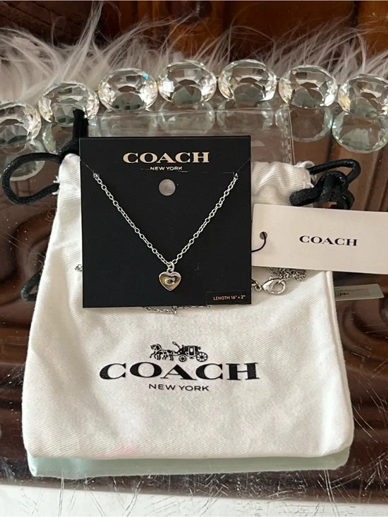 Coach  NWT Silver Heart Charm Necklace 16’ and dush bag
