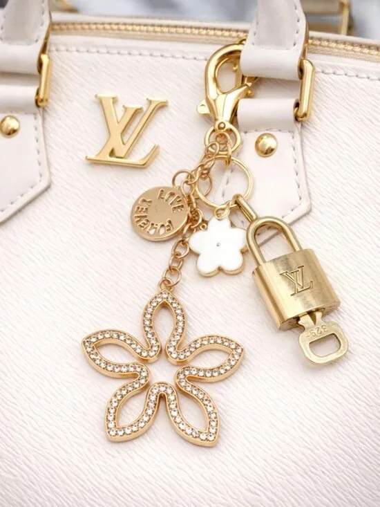 Authentic Louis Vuitton Gold Lock & Key 🔑 Bag Charm w/ Unbranded Clover Charm
