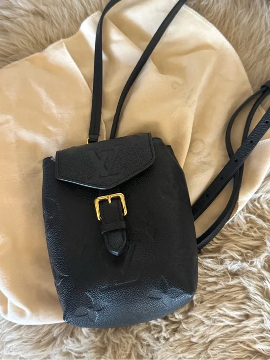 Louis Vuitton Black Leather Mini Backpack with Gold Buckle