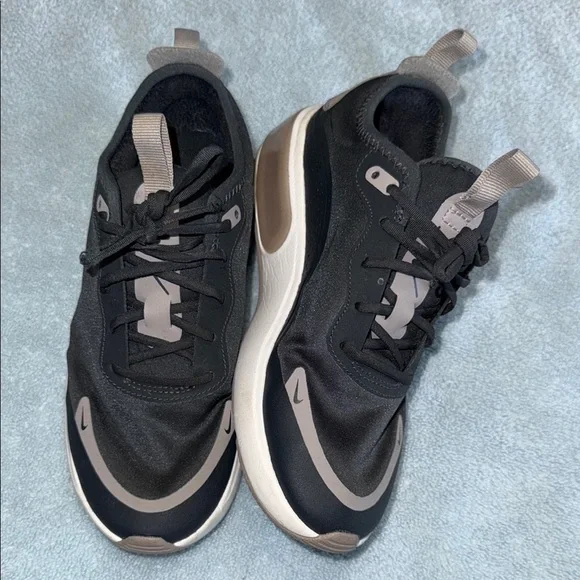 Nike women’s Black and Tan Sneakers