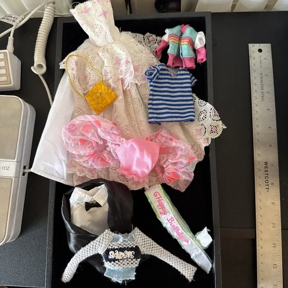 Lotof Barbie doll clothesincluding 1‎ gown, o1 purse, a tuxedo Coat shirt, &more