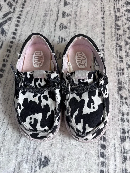 Hey Dude Kids Black & White Cow Print Slip-Ons with Pink Lining