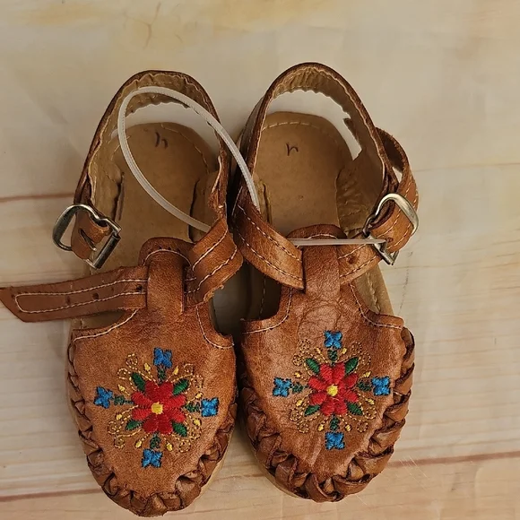 Brown and Red Moccasins with Beadwork and Fringe