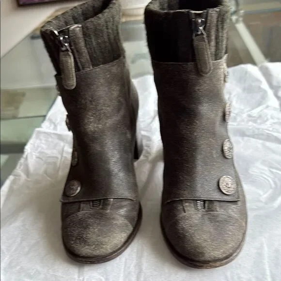 Chanel Women’s Gray Distressed Suede Leather Ankle Boots with CC Logo Buttons.
