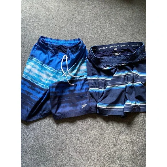 Speedo Two Men’s blue stripped bathing suit.