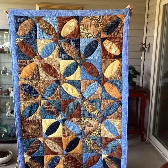 Patchwork Quilt with Blue and Brown Tones