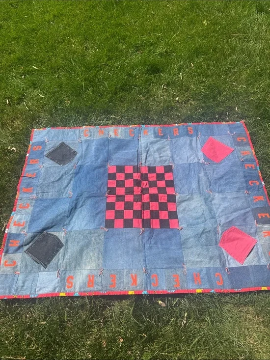 Upcycled Denim Checkers Game Mat with denim pockets to hold checkers.
