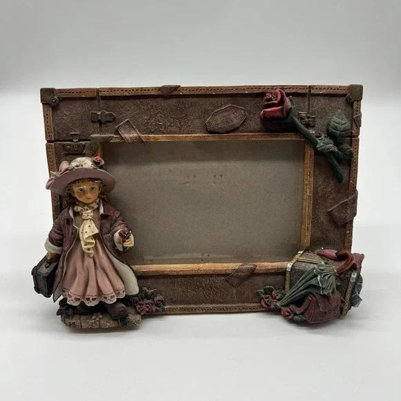 A Richesco Corporation Girl With Roses Suitcase Hand Painted Resin picture frame