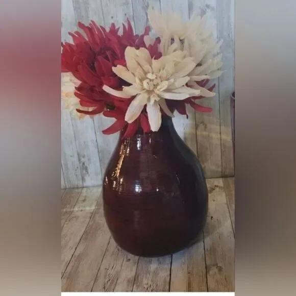 Large red decorative lacquerware vace and flowers