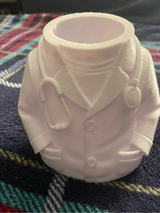 Desktop doctor with white coat and stethoscope molded pencil cup