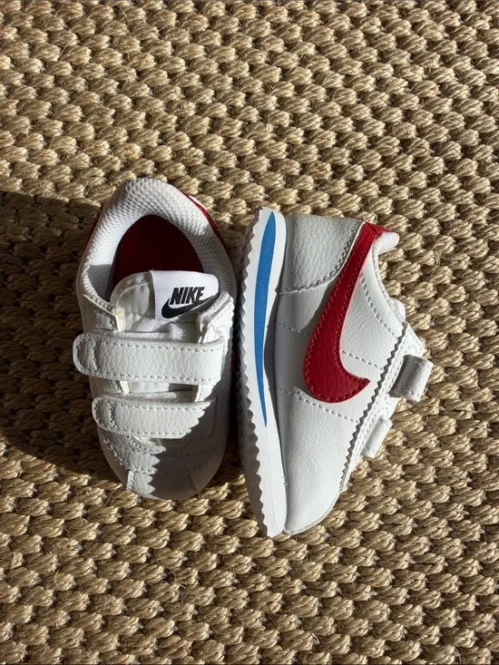 Nike White Baby Sneakers with Red Swoosh and Blue Accent size 4c