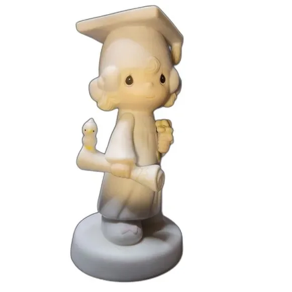 Precious Moments graduation figurine