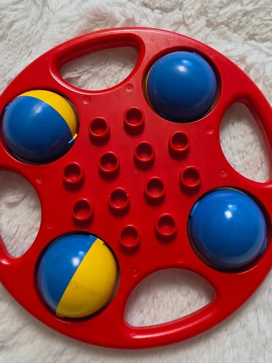 Vintage LEGO Duplo Circular Rattle Red with Blue Yellow Wheels
