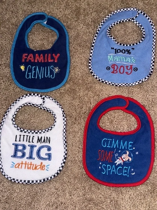 4 baby bibs with embroidered text and graphics