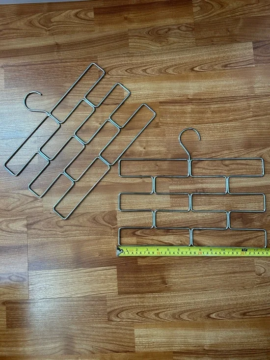Two metal brickwork scarf tie hangers