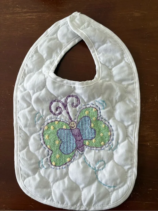 Hand embroidered butterfly quilted baby bib