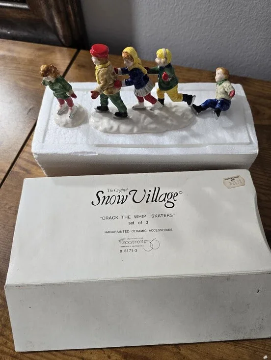 Department 56 Snow Village figurines titled 