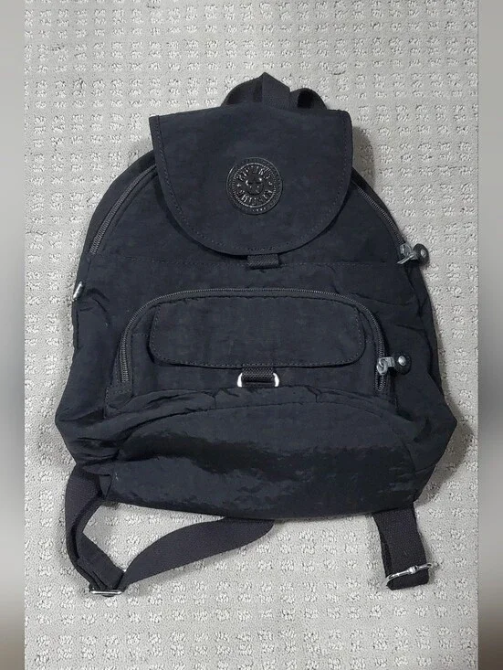 Kipling Queenie Small Backpack Black Nylon Brand Logo on the front flap.