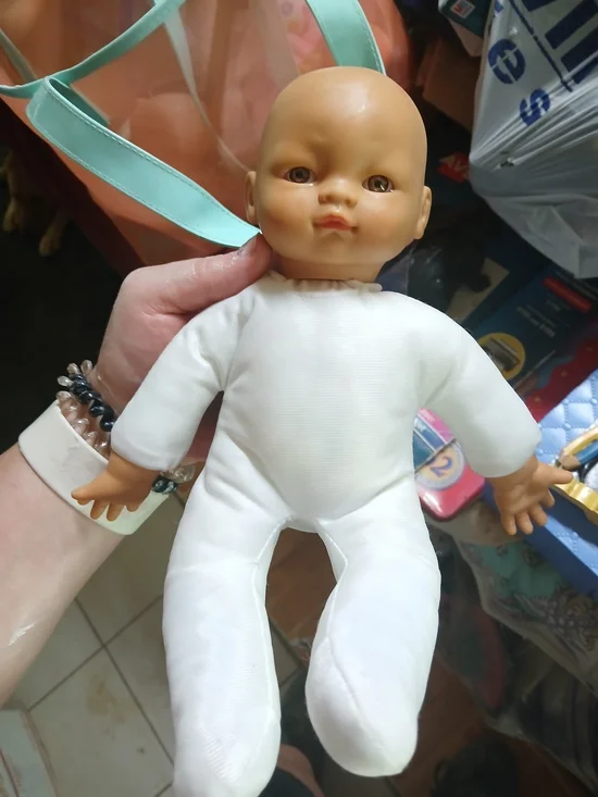 Uneeda baby doll with a soft cloth body and vinyl limbs