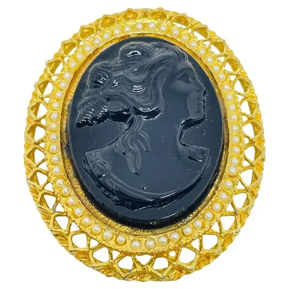 Vintage gold tone molded glass black cameo brooch