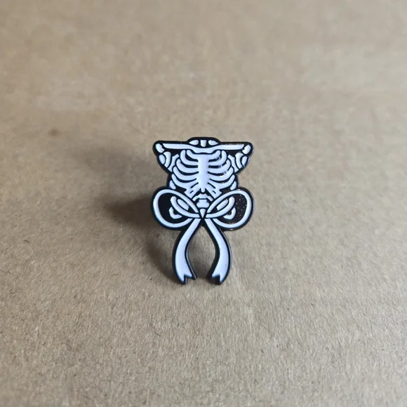 Skeleton Ribcage Bow Enamel Pin